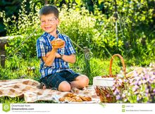 Cute-kid-boy-having-picnic-garden-54957242.jpg